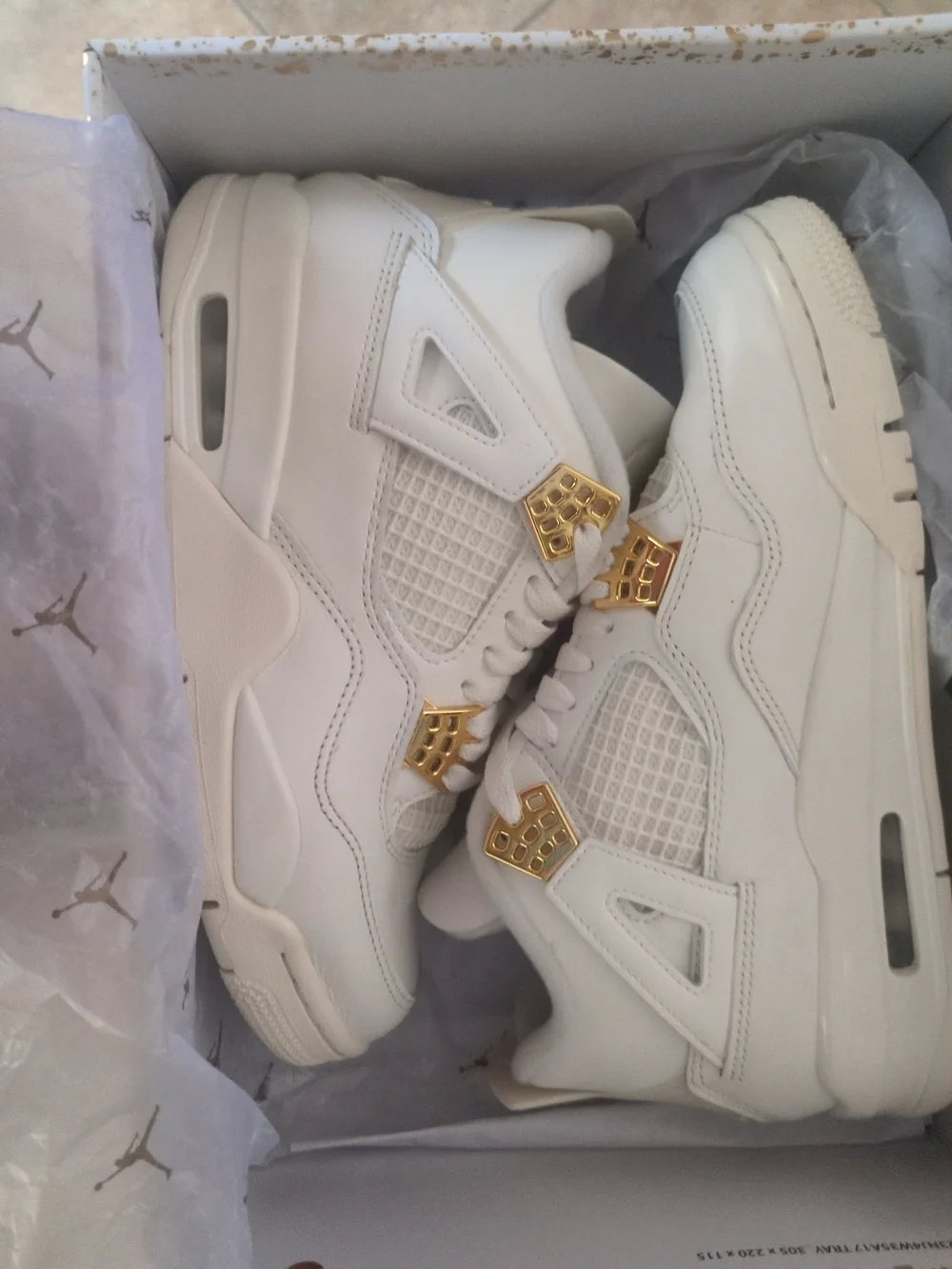 Air Jordan Women's All-White Sneakers with Gold Accents